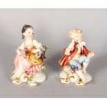 A PAIR OF CAPODIMONTE PORCELAIN GROUPS, young boy and girl. 5ins high.