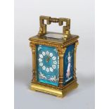 A GOOD SMALL FRENCH BRASS CARRIAGE CLOCK, with blue champleve panels, enamelled numerals, the panels