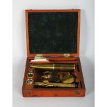 A RARE TRAVELLING FIELD MICROSCOPE in a mahogany case. 6ins.