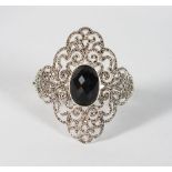 A LARGE VICTORIAN STYLE ONYX AND MARCASITE BANGLE.