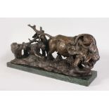 AN UNUSUAL NATURALISTIC BRONZE OF A WATER BUFFALO BEING ATTACKED BY TIGERS, on a rectangular
