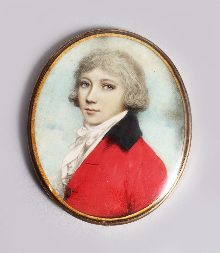 A GOOD GEORGIAN OVAL MINIATURE OF A YOUNG BOY, WITH WHITE WIG, WHITE CRAVAT, RED COAT AND BLACK