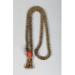 A GOLD NECKLACE, mounted with a carved coral cameo.