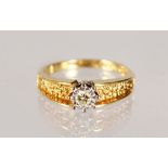 AN 18CT YELLOW GOLD AND DIAMOND RING.