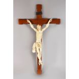 A GOOD ITALIAN CARVED IVORY FIGURE OF CORPUS CHRISTI, on a wooden crucifix. 32ins high.