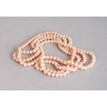A STRING OF PINK PEARLS. 2ft long.
