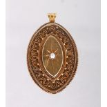 A VICTORIAN 15CT GOLD AND PEARL OVAL LOCKET.