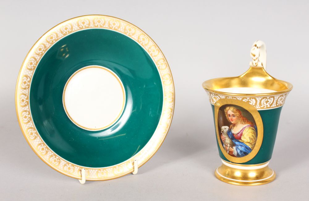 A LOVELY BERLIN CUP AND SAUCER, rose and gilt, painted with an oval of a young girl with a lamb.