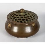 A SMALL CHINESE BRONZE GOLD SPLASH CENSER. 3ins high.