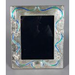A SILVER AND BLUE ENAMEL PHOTOGRAPH FRAME. 11.5ins x 8ins.