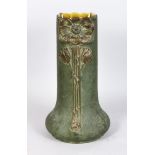 A JULIUS DRESSLER POTTERY VASE, green matt glaze, with moulded floral decoration. Impressed marks to