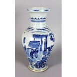 A CHINESE BLUE AND WHITE VASE, decorated with figures and animals. 1ft 4ins high.