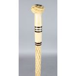 A 19TH CENTURY MARINE IVORY WALKING STICK, POSSIBLY NORTH AMERICAN. The handle carved with a Turks