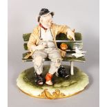 A CAPODIMONTE PORCELAIN GROUP, an old man on a bench feeding the birds. Signed MERLI. Mark in