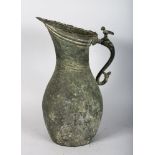 A 10TH-12TH CENTURY ISLAMIC KHOROSAN METAL JUG. 14ins high.