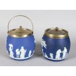 TWO WEDGWOOD BLUE AND WHITE JASPER WARE BISCUIT BARRELS with plated lid, one with a handle. 5ins