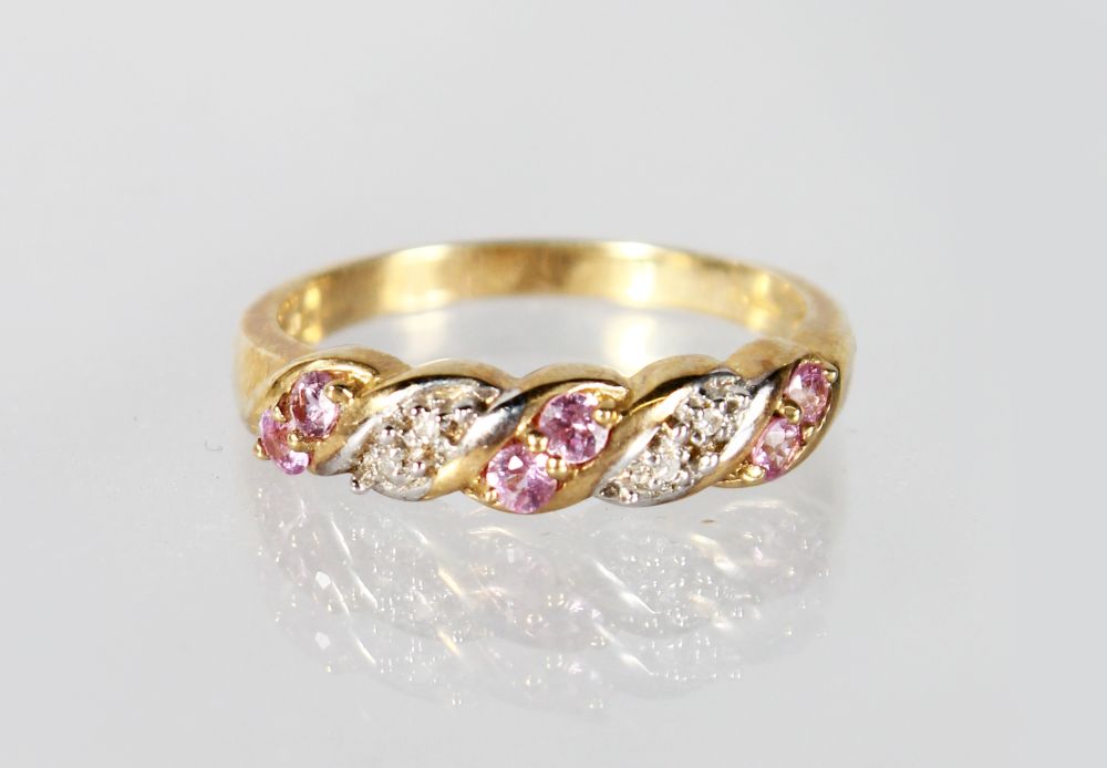 A 9CT GOLD, PINK SAPPHIRE AND DIAMOND RING.