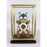 A GOOD SKELETON CLOCK, 20TH CENTURY, with moon phase movement in a glass case. 1ft 8ins high.