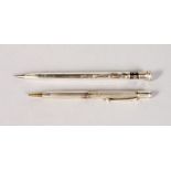 TWO SILVER PROPELLING PENCILS.