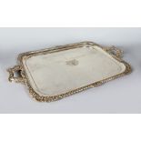 A LARGE VERY HEAVY TWO-HANDLED SILVER TEA TRAY with gadrooned edge, shell mounts, oak leaves and