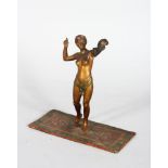 A BERGMAN STYLE COLD PAINTED BRONZE, a semi nude female figure holding a snake. 5ins high.