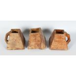 THREE 19TH CENTURY SQUARE TAPERING CANDLE BOXES with carrying handles. 6ins high.