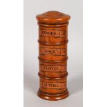 A FOUR TIER WOODEN SPICE TOWER. 8ins high.