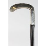 A WALKING STICK, with plain silver handle.