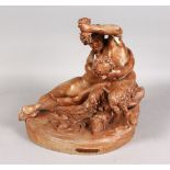 AFTER CLODION "FAUNE A LA GRAPPE" a 19th Century painted plaster group, 12ins high.
