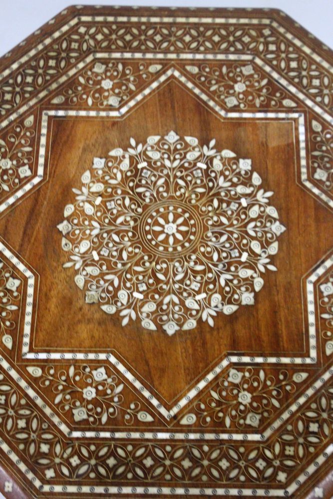 AN INDIAN OCTAGONAL SHAPED FOLDING TABLE, CIRCA 1900, with profusely inlaid floral decoration. 1ft - Image 3 of 3
