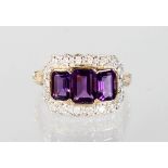 A 9CT GOLD, AMETHYST AND DIAMOND RING.