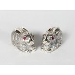 A GOOD PAIR OF SILVER RABBIT SALT AND PEPPERS with ruby eyes.