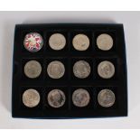 A CASE OF 12 SILVER CROWNS AND COMMONWEALTH CROWNS, including 1951 etc.