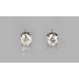 A PAIR OF 18ct GOLD DIAMOND STUD EARRINGS.