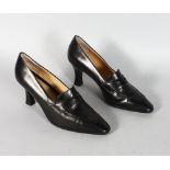 A PAIR OF PRADA BROWN LEATHER SHOES. Size 37.5 (one worn).