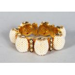 A VERY GOOD 18CT GOLD SEED PEARL, DIAMOND AND BLUE ENAMEL BRACELET, set with seven large clusters of