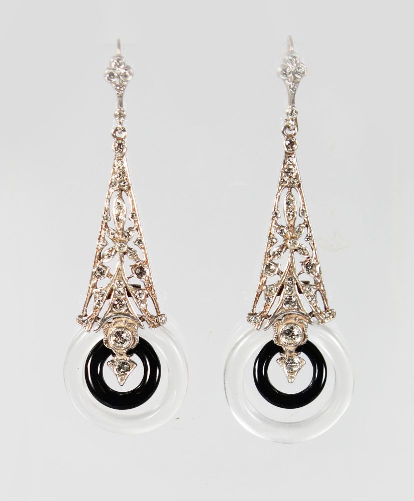 A PAIR OF 9CT GOLD AND SILVER DECO STYLE ONYX AND ROCK CRYSTAL PENDANT EARRINGS.