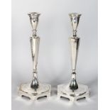 A PAIR OF CONTINENTAL SILVER HEXAGONAL TAPERING CANDLESTICKS. 14ins high. Weight 20ozs.