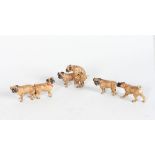 A SET OF THREE SMALL AUSTRIAN PUG DOGS.