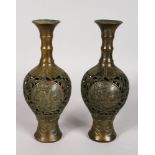 A PAIR OF JAPANESE PIERCED BRONZE VASES. 10ins high.