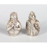 A GOOD PAIR OF SILVER PUNCH AND JUDY SALT AND PEPPERS.
