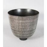 A GOOD LARGE CIRCULAR BOWL by RUPERT SPIRA, of slightly tapering form, dark grey matt glaze with