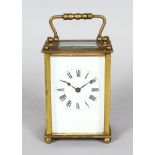 A 19TH CENTURY FRENCH BRASS CARRIAGE CLOCK. 4ins high.