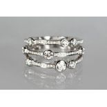 AN UNUSUAL 18CT WHITE GOLD DIAMOND TRIPLE ROW RING of 75 points.