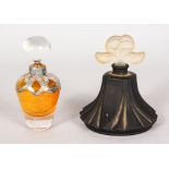 A SILVER OVERLAY SCENT BOTTLE AND STOPPER, 10cms high, and a LALIQUE pattern coloured scent
