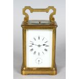 A 19TH CENTURY FRENCH BRASS REPEATER CARRIAGE CLOCK with alarm. 5ins high.