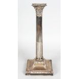 A SINGLE LARGE VICTORIAN CORINTHIAN COLUMN CANDLESTICK on square loaded base. 12ins high.