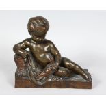 A GOOD FRENCH BRONZE OF A CUPID holding a bird, on a rectangular base. 9ins long.