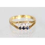 AN 18CT GOLD, DIAMOND AND SAPPHIRE RING.