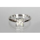AN 18CT WHITE GOLD PRINCESS CUT DIAMOND RING of 90 points, colour I, clarity Si.